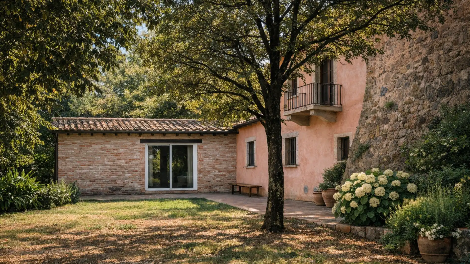 Annex exterior with shaded garden, tree and stone facade surrounded by Tuscan nature - Castello di Leonina, BZAR hotels in Tuscany