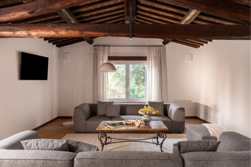 Bright lounge at the Villa Annex Adults Only with sofas and garden views, surrounded by the Tuscan Crete Senesi - Castello di Leonina, BZAR hotels in Tuscany
